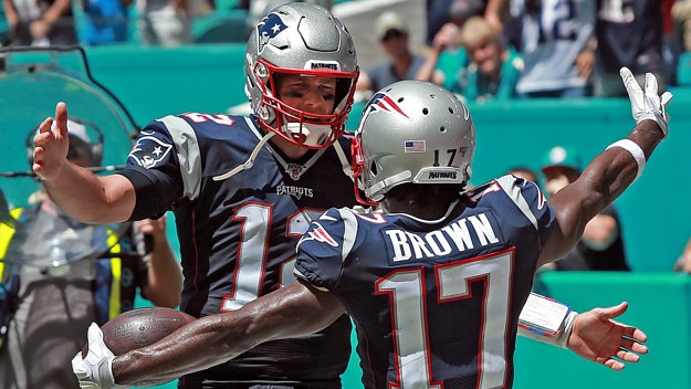 Tom Brady and Antonio Brown embrace after a touchdown.