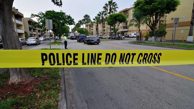 Police tape blocks the street