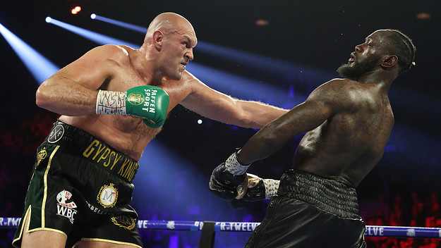 Tyson Fury punches Deontay Wilder