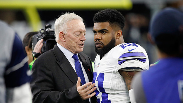 Dallas Cowboys owner Jerry Jones talks with Ezekiel Elliott