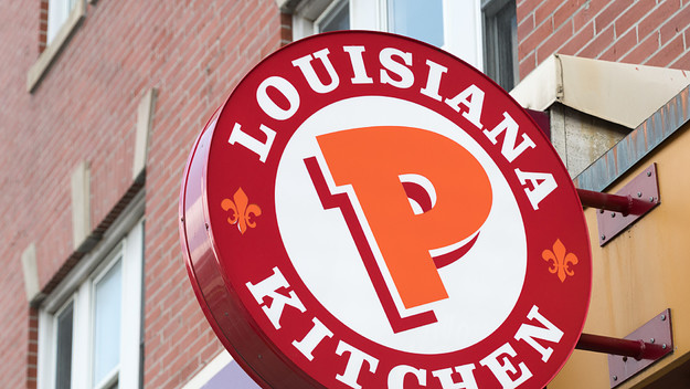 Popeyes Lousiana Kitchen sing or logo outside a restaurant wall.