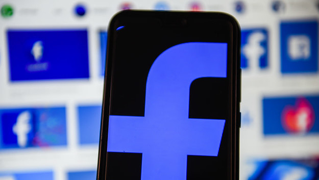 In this photo illustration a Facebook logo displayed on a smartphone