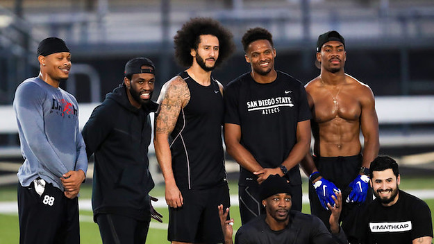 Colin Kaepernick stands with Jordan Veasy, among others. during NFL workout