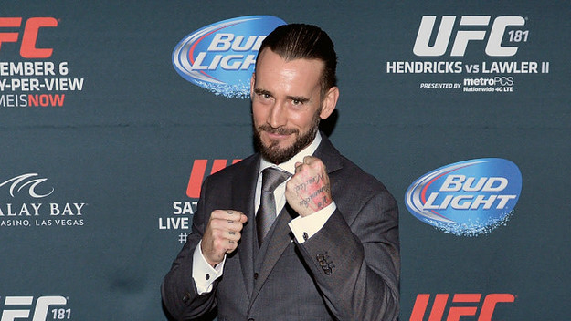 Phil 'CM Punk' Brooks poses backstage