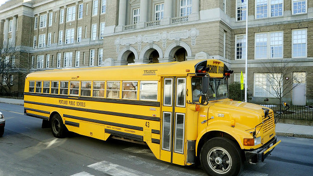 A school bus passes by Portland High School