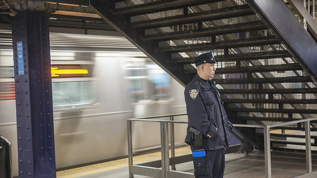 An NYPD officer is seen in the Times Square station in New York.