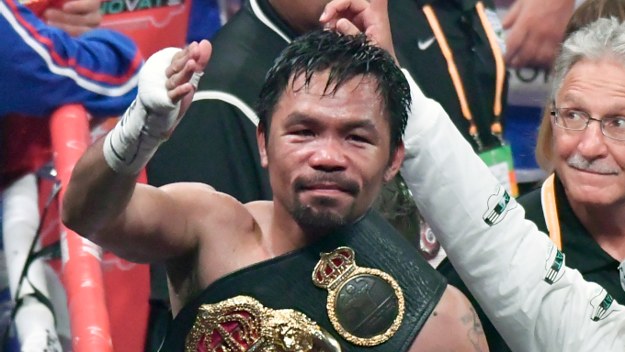 Manny Pacquiao waves to his fans after going 12 rounds