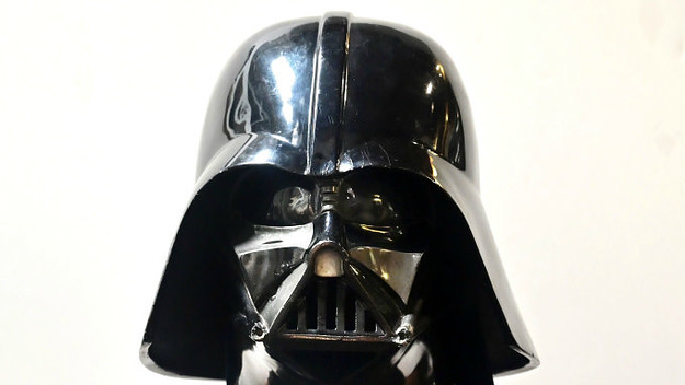 A Darth Vader helmet and mask from the film "The Empire Strikes Back" on display