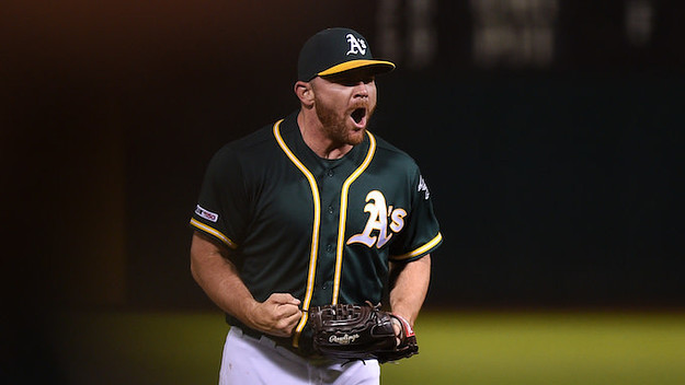 Liam Hendriks celebrates after recording the final out in the ninth inning.