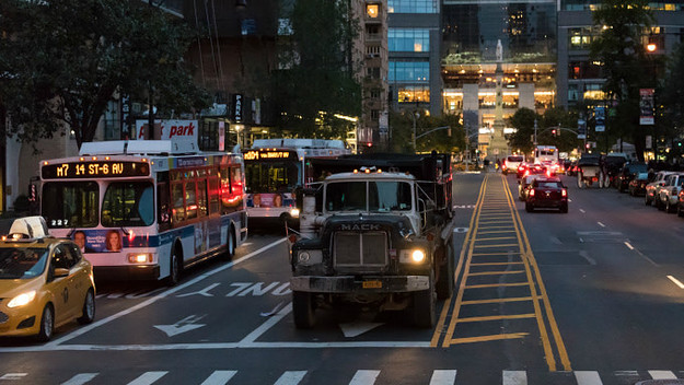 Historic district: traffic at dawn, truck and public buses rushing to their destination