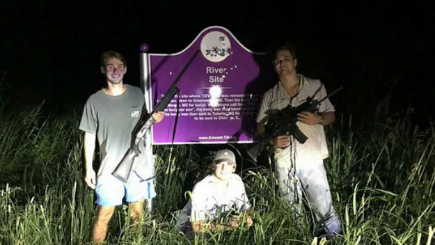 Ole Miss fraternity students pose in front of Emmett Till memorial sign