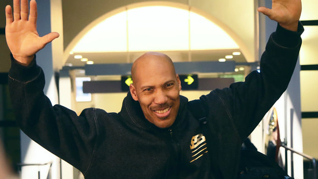 US entrepreneur LaVar Ball waves upon his arrival with his sons at Vilnius airport in Lithuania