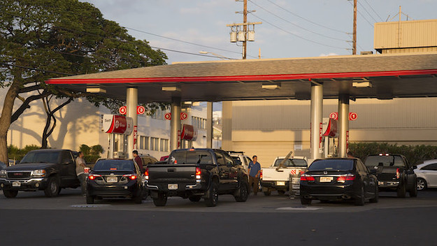 Continuous lines of vehicles find gasoline at the Texaco station.