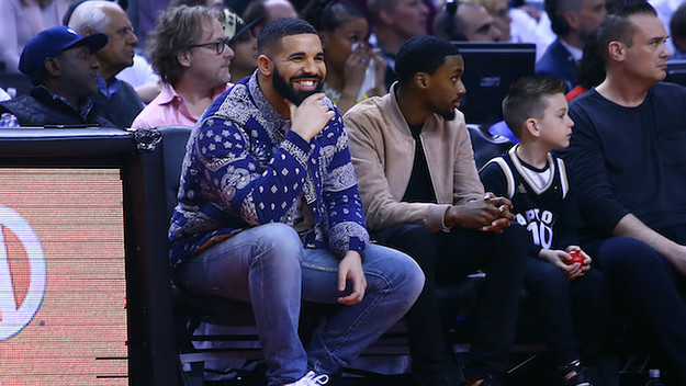 Drake sits courtside during 76ers/Raptors 2019 NBA Playoffs game. .