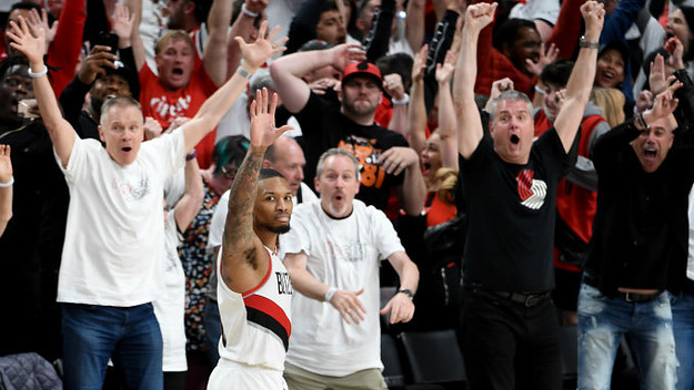 Damian Lillard #0 of the Portland Trail Blazers waves over to the OKC bench