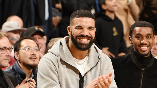 Drake celebrates during the game