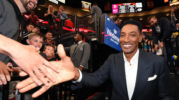 NBA legend Scottie Pippen high fives a fan before Game Four of the Western Conference Finals