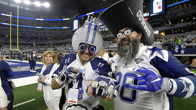 Dallas Cowboys fans on the field before action against the Seattle Seahawks.