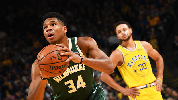 Giannis Antetokounmpo shoots free throws against the Warriors.