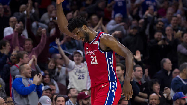 Joel Embiid invites the crowd to make some noise.