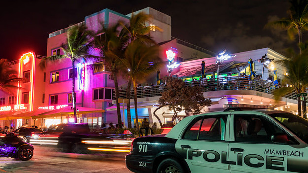Florida, Miami Beach, Wet Willie's at night with Police Cruiser