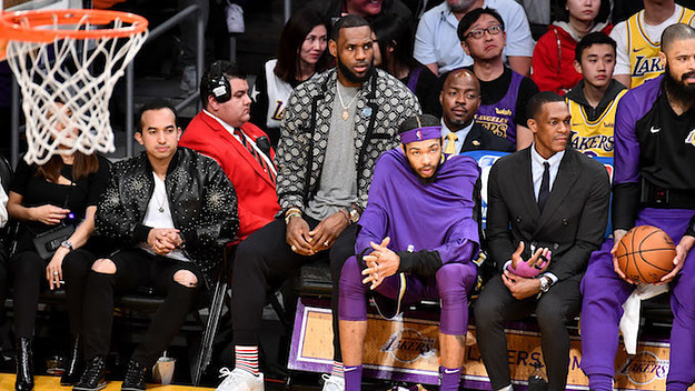 LeBron James on bench in street clothes