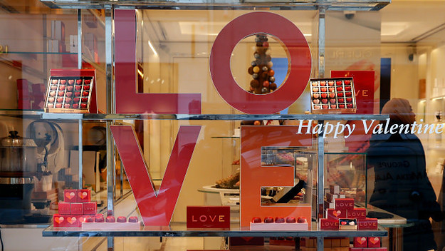heart shaped chocolates are seen in the window of a pastry shop