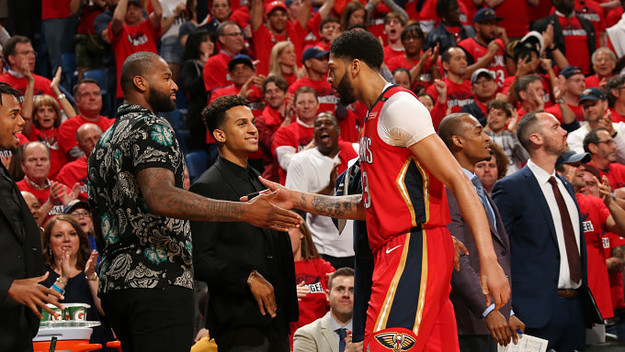 Anthony Davis #23 of the New Orleans Pelicans high fives DeMarcus Cousins #0