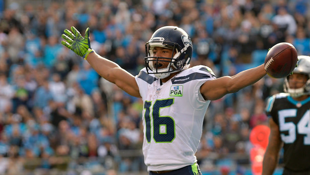 Tyler Lockett #16 of the Seattle Seahawks celebrates a touchdown against the Carolina Panthers