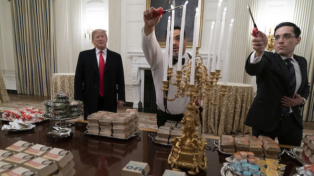President Donald Trump presents fast food to be served to the Clemson Tigers.