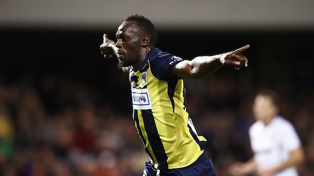 Usain Bolt of the Mariners celebrates scoring a goal.