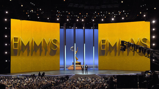 Colin Jost (L) and Michael Che speak onstage during the 70th Emmy Awards.