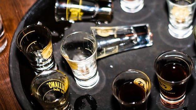 Empty and full shot glasses ready to be consumed.