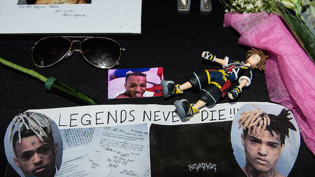 A fan made poster at XXXTentacion's funeral.