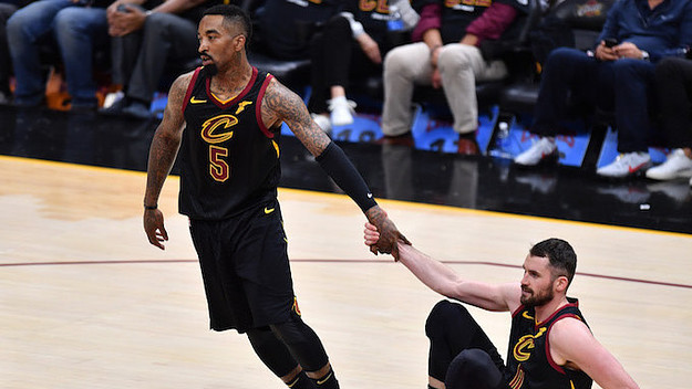 R Smith #5 of the Cleveland Cavaliers helps Kevin Love.