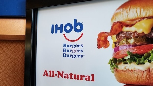 Close up of sign with IHoB (International House of Burgers) logo.