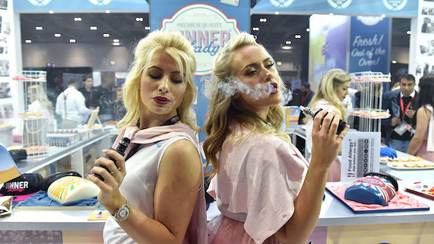 Two women vaping at Vape Jam UK.