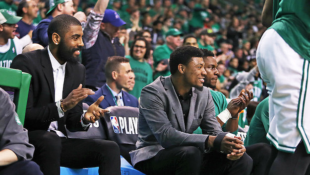 Injured Boston Celtics guards Kyrie Irving, left, and Marcus Smart.