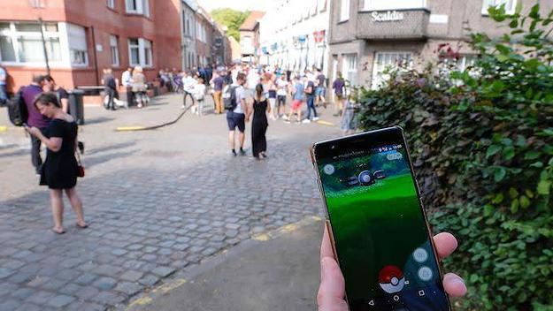 People play at the Pokemon GO augmented reality game.
