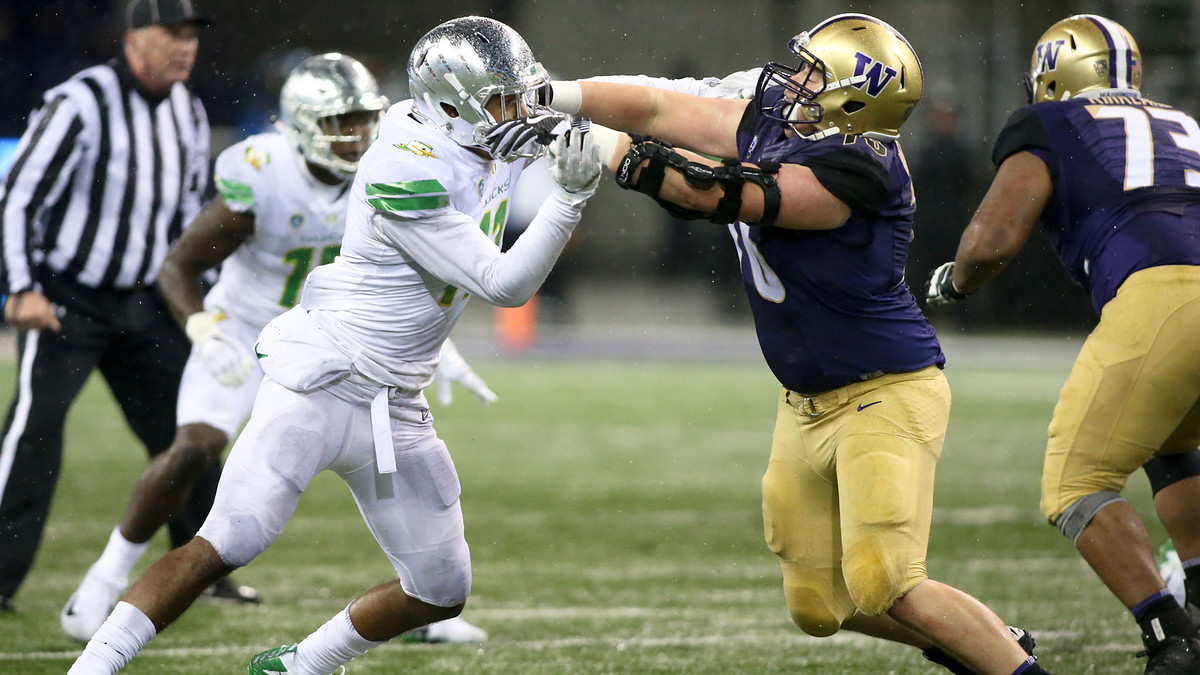 Washington Huskies' Luke Wattenberg Blocks Justin Hollins of the Oregon Ducks