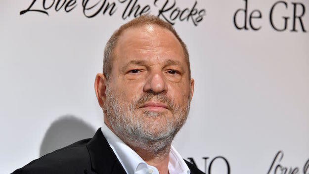 Harvey Weinstein poses during a photocall as he arrives to attend the De Grisogono Party.