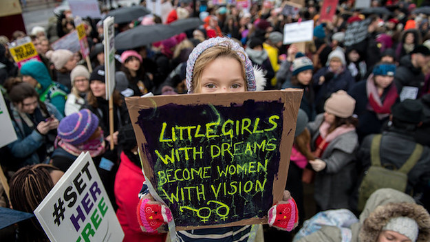 A little girl at a Time's Up rally in London.