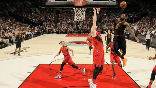 LeBron James dunks over Jusuf Nurkic.