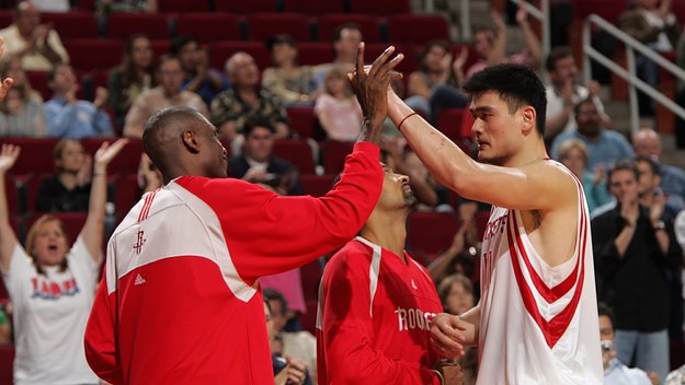 This is a photo of Dikembe Mutombo and Yao Ming