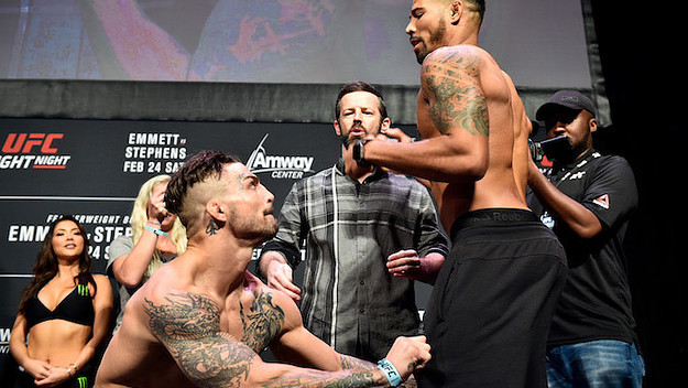 Mike Perry attempts to remove the pants of Max Griffin