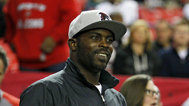 Michael Vick walks onto the sidelines prior to an NFL football game.
