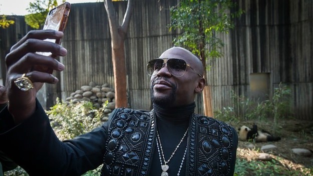 Floyd Mayweather adopts a panda in China.
