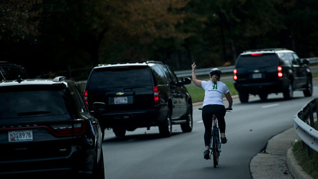 Woman gives Trump the finger