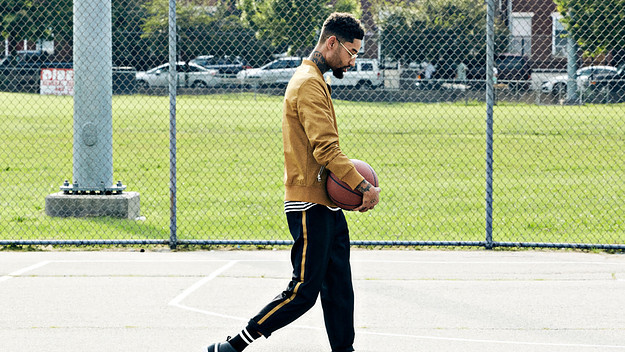 PnB Rock wearing the PUMA Clyde Mid Foil Sneakers