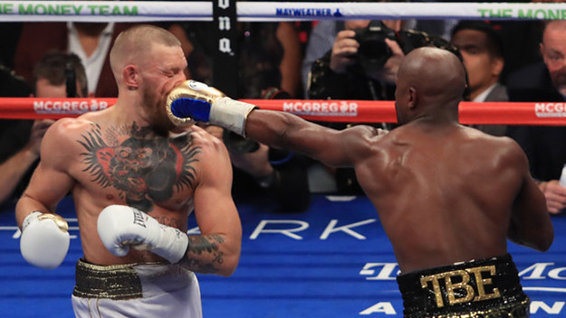 Conor McGregor getting punched in the face by Floyd Mayweather